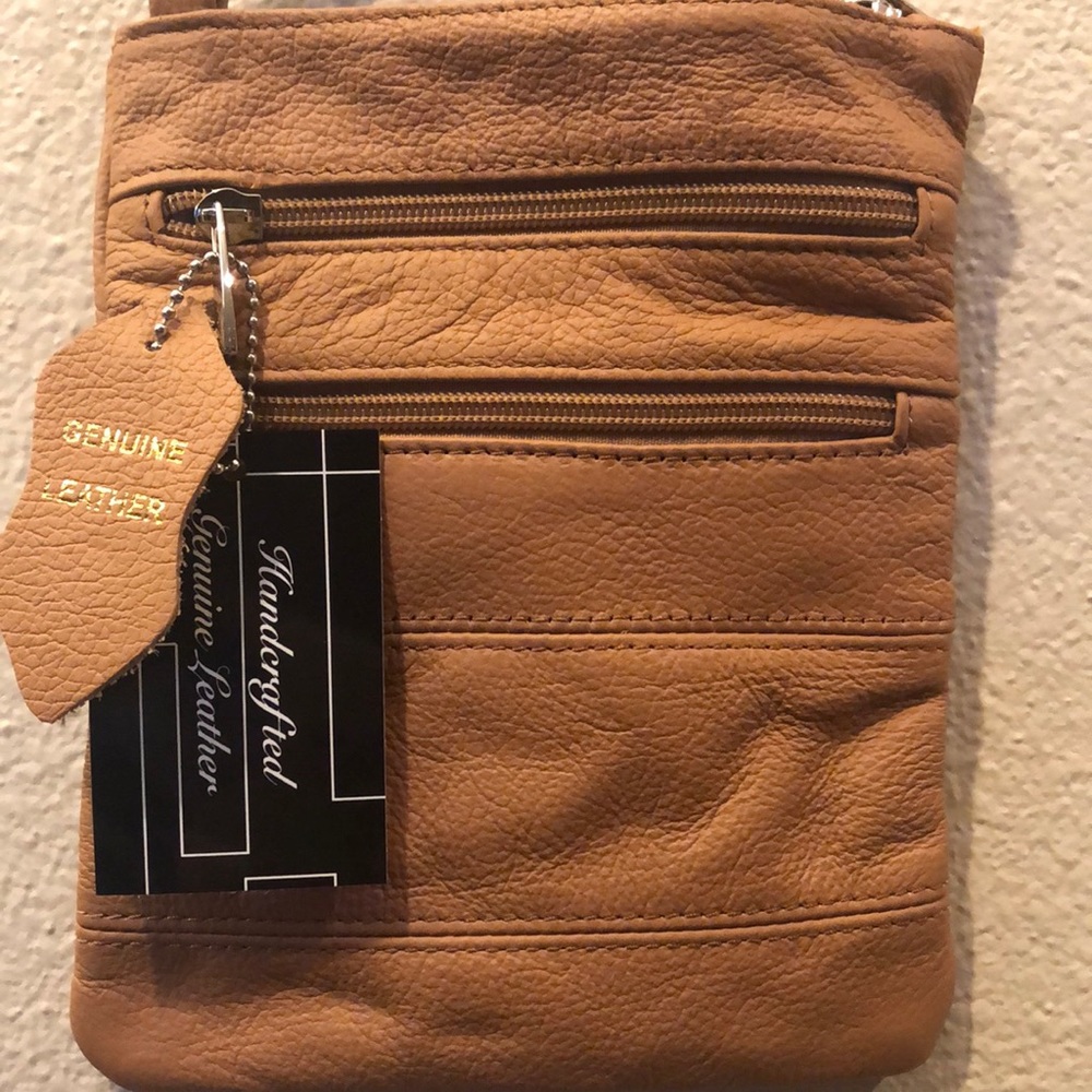 Real leather cross body bag .